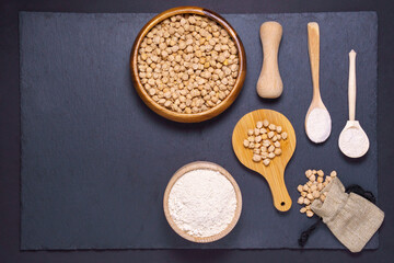 Raw chickpeas in bowl on a dark background. A view from above. copyspace