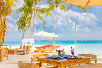 Luxury resort hotel poolside, outdoor restaurant on the beach, ocean and sky, tropical island cafe,...