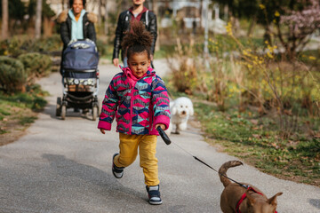 Portrait of girl walking a dog