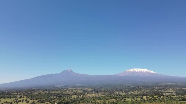 Kilimanjaro Hiking over the volcano mountains rocky trekkers in loitokiotok kenya. Paris Agreement.
