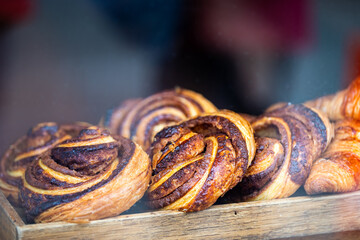 Laugavegur street in downtown with bakery cafe store shop window display of croissant, French and...