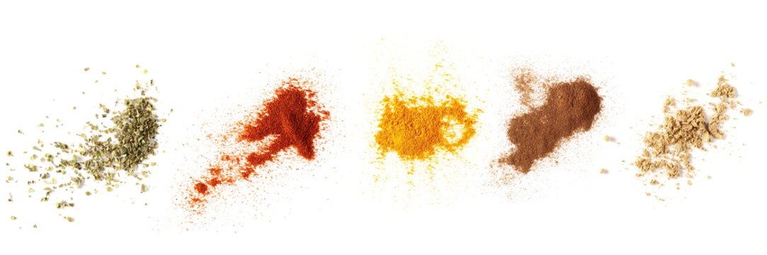 Set spices pile, oregano, red paprika powder, turmeric, cinnamon, ginger, isolated on white background, top view texture