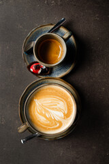 cup of cappuccino with desserts