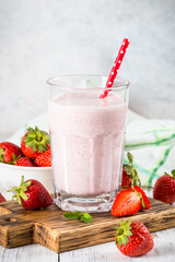 Strawberry smoothie or milkshake at white.