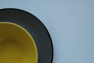 plates of yellow gray on a light white background with a ist for text and a copyspace