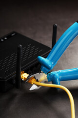 Cutting and disconnecting the network Internet connection with cutting pliers.
