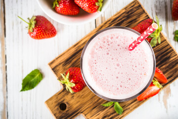 Strawberry smoothie or milkshake at white.