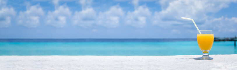 Fototapeta premium Fruity welcome drink on tropical vacation. Long banner