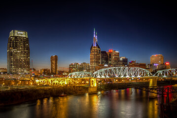 Fototapeta na wymiar Nashville night skyline along the Cumberland river from the Korean Veterans Blvd bridge