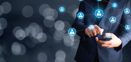 man holding phone with social network icon