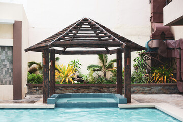 Wooden palapa above swimming pool, nobody