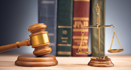 scales with judge gavel and law book