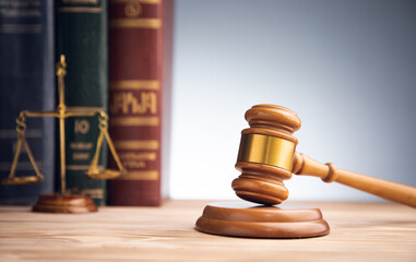 scales with judge gavel and law book