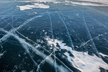 Blue background of Ice texture. Lake Baikal in Winter