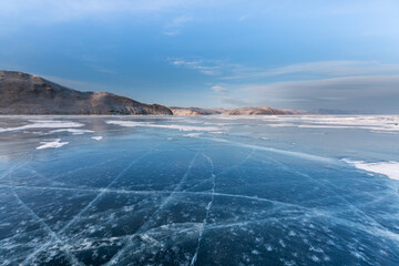 Frozen Lake Baikal. Blue ice, winter landscape.