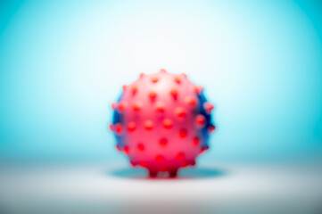 Blurred concept image of the coronavirus on the blue background