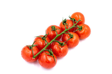 Fresh cherry tomatoes on a branch with water drops. White background. Top view.
