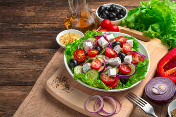 Fresh vegetable salad. Greek salad on a wooden background.