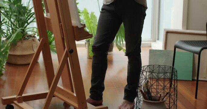 Young Chinese man painting at home,4K