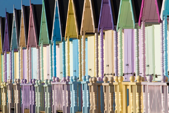 Parade of colourful beach huts on Mersea Island in Essex