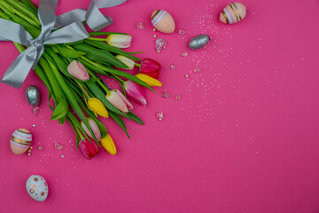 background for greeting card design with Easter eggs and tulip