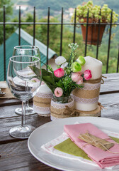 Wedding table setting against the backdrop of a mountain landscape.