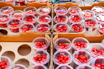 cherry tomatoes in plastic containers in super market