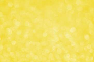 Illuminating Pantone Color Of The Year 2021. Abstract festive bokeh background with shining defocus sparkles. Blurred glitters shimmering dust macro close up, copy space for text logo