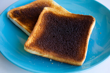 Burnt toast bread on plate