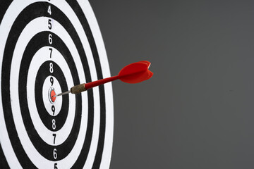 Dart hit target on black background