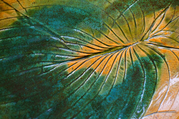 Turquoise and yellow leaf. Abstract background with stripes