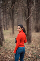 A young girl on a walk. Enjoys autumn colors. 