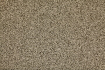 Mosaic and granulated textured coating, texture, background. Structural plaster, rough, uneven surface in brown color. Modern exterior cladding of multi-story buildings