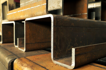 Products from thick, sheet metal bent on a bending machine. Iron parts close-up. 