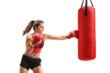 Young woman training box and punching a bag dnytr