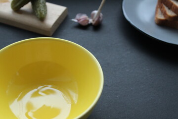 served a table-like bowl of bread on a plate on a black background of a grey tablecloth with a place for text and a copyspace