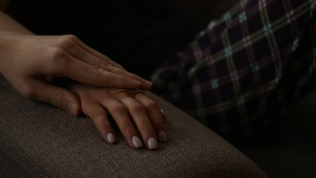 Love hands concept. Couple in love. Video. Sofa. Hope. 