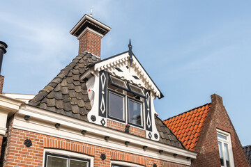 Window decoration on the top floor of a house in Friesland, Netherlands