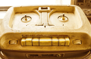 Old vintage player of reels. The antique Reel-to-Reel. Tape Recorder with spools. Bobbin tape...