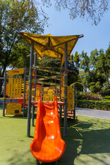 A closeup of a slide on a closed playground due to COVID-19 pandemic