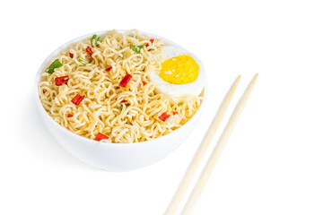 Instant noodles with vegetables and herbs in bowl isolated on white