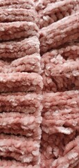 Texture of a knitted hat. Texture of a knitted sweater. Knitted pattern powder color.