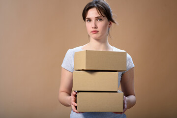 girl close up three cardboard boxes online delivery concept