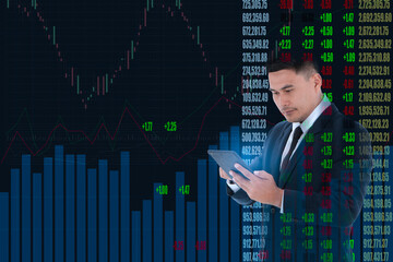  Businessman looking tablet screen stock market