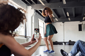 Happy Afro American woman is showing new dance