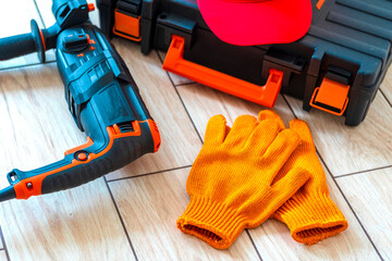 Working tools.rotary hammer, tool box, work cap, gloves,