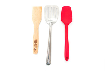 silicone, wooden, metal spatulas isolated on white