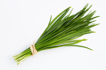 Fresh Chinese Chive leaves on white