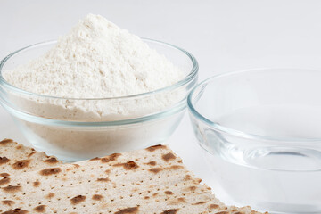 Jewish matzah on white background. Jewish traditional Passover bread. Pesach celebration symbol. Close-up