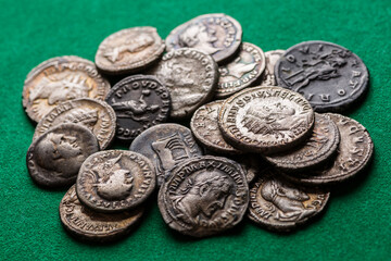 A treasure of Roman gold and silver coins.Trajan Decius. AD 249-251. AV Aureus.Ancient coin of the...